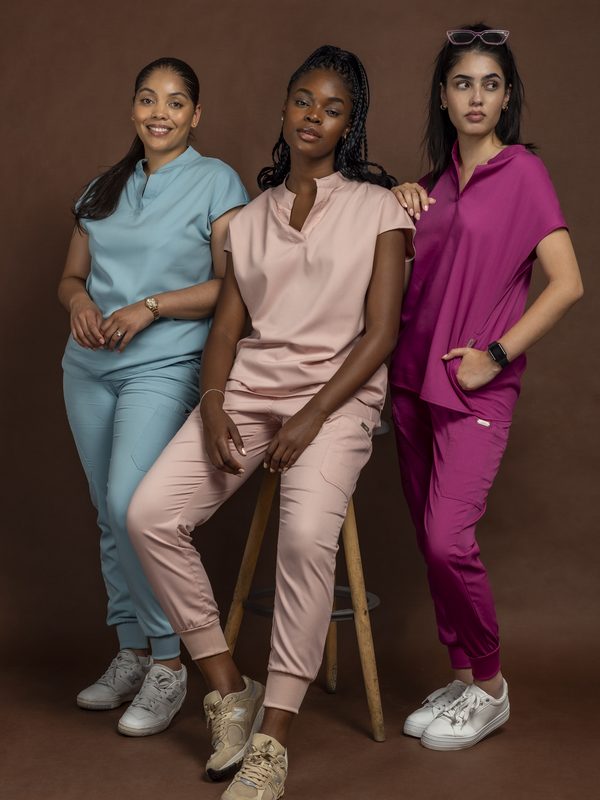 Three healthcare workers in Solo Jade Sleeve scrub sets